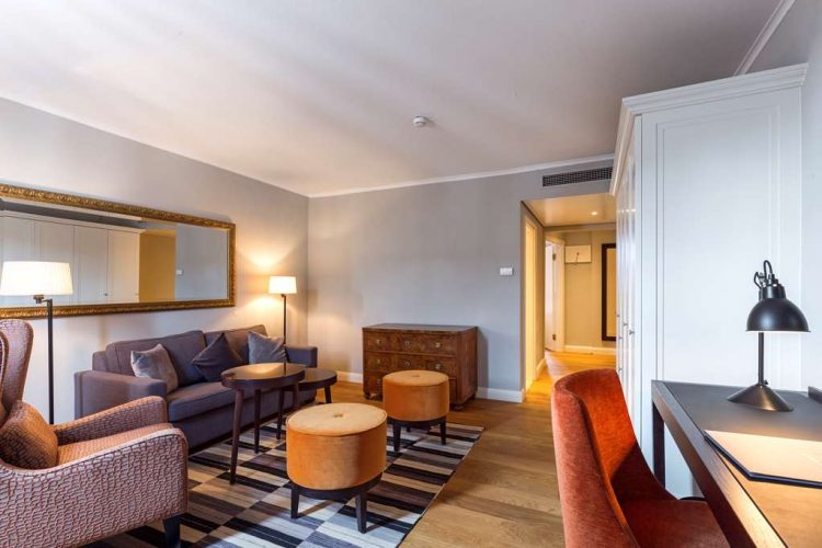 living room suite with sofabed, armchair and desk