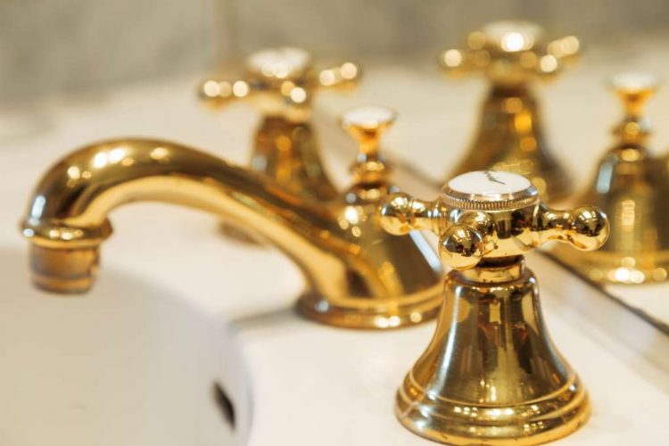 golden tap in the bathroom of the standard room